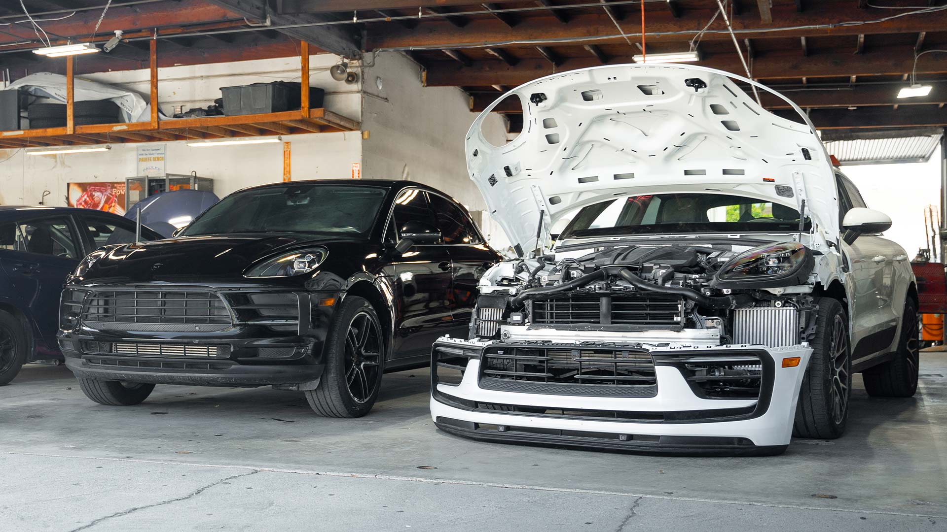 damaged porsche macan and cayenne