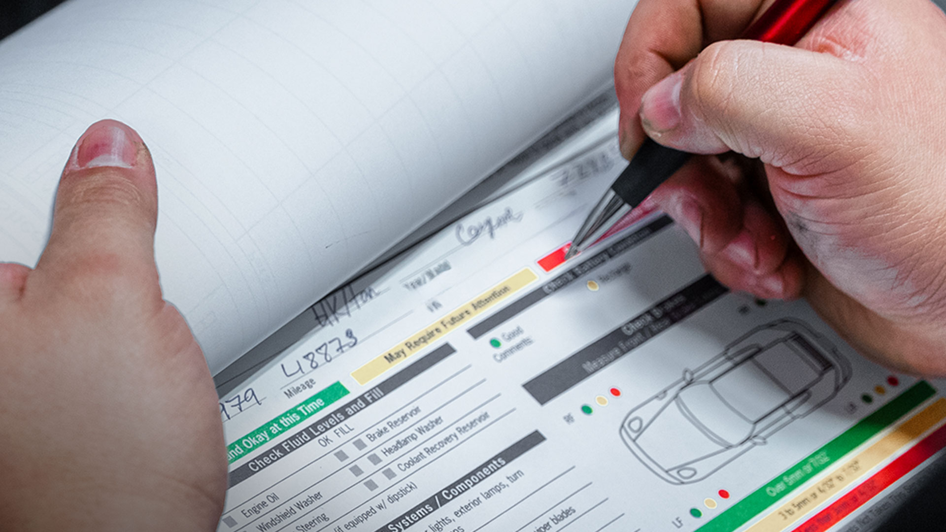 house automotive technician reviewing a porsche multi-point inspection report