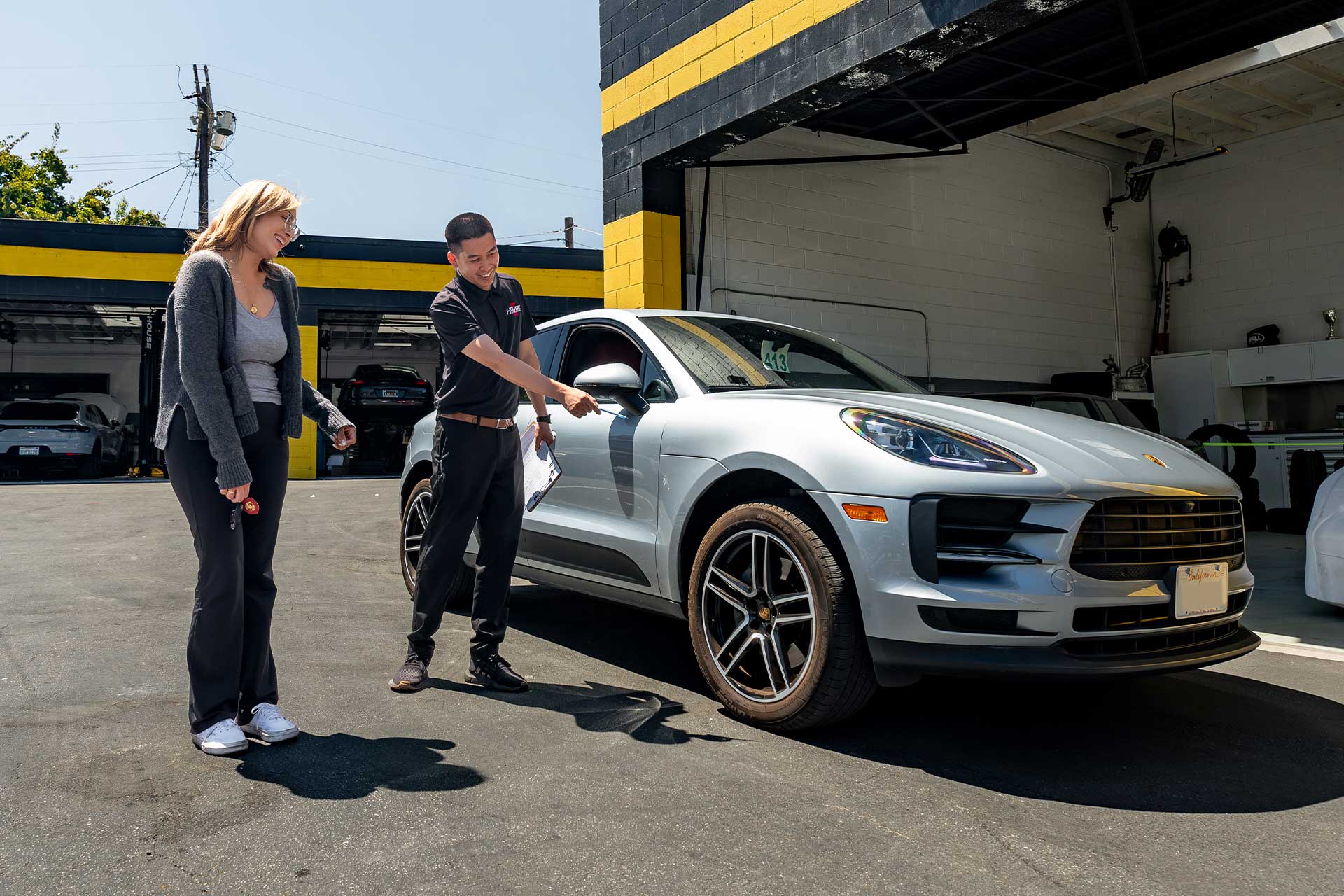 john from house ag showing customer inspection of porsche macan