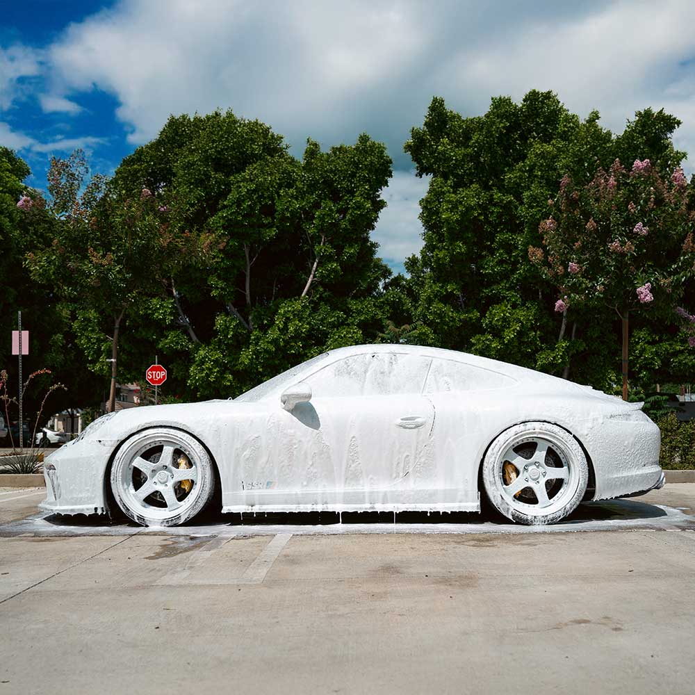 porsche 911 covered in car wash soap