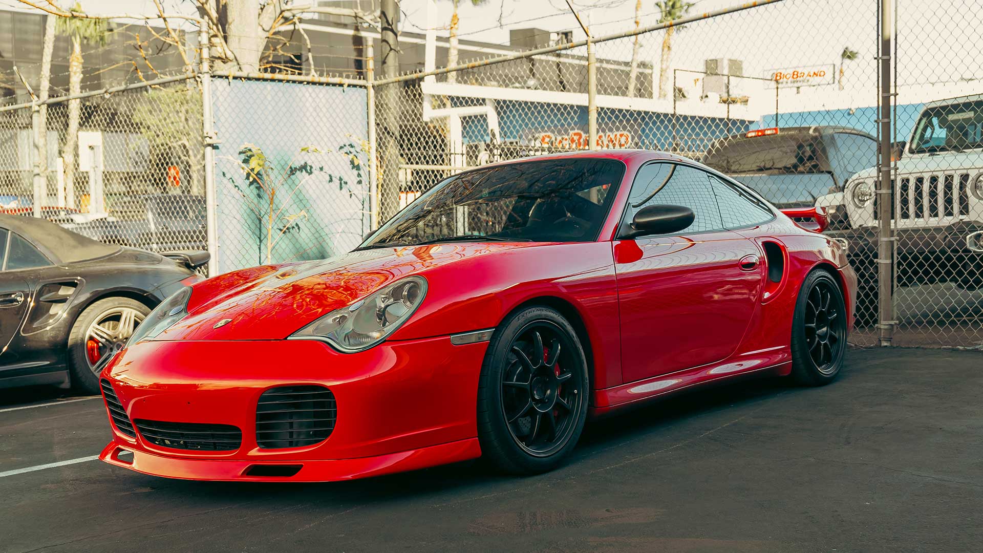 red porsche 911 turbo with modifications showcasing performance options for buyers guide