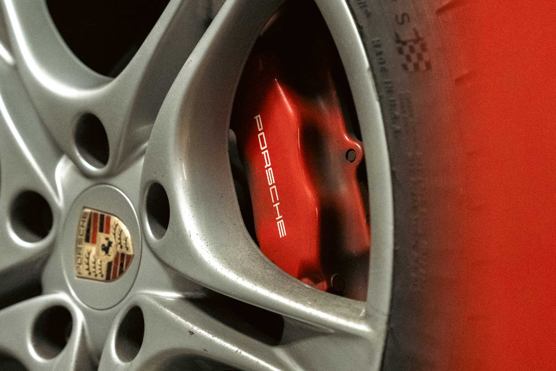 porsche with red brake calipers