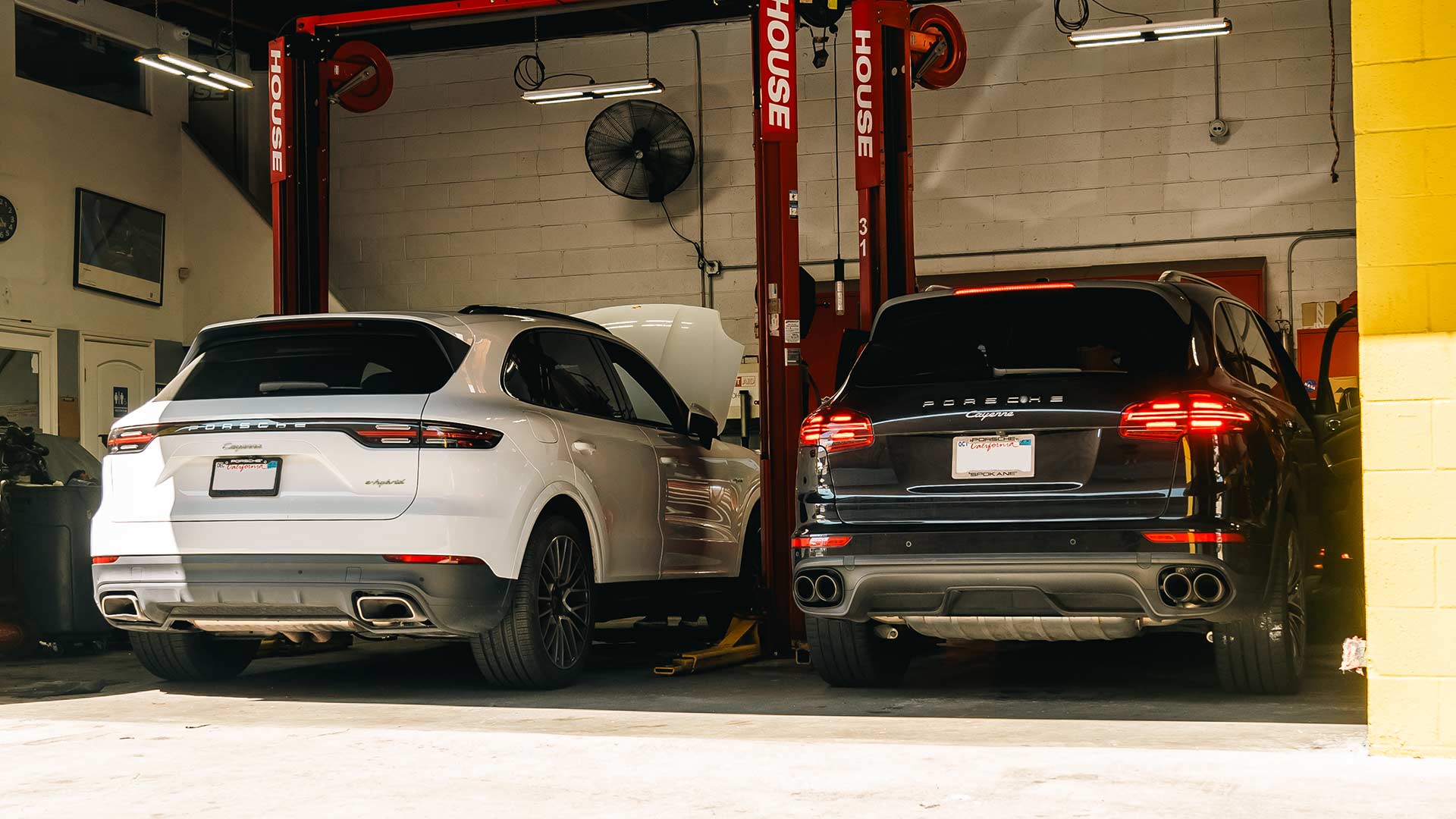 two porsche cayennes in for service at house automotive