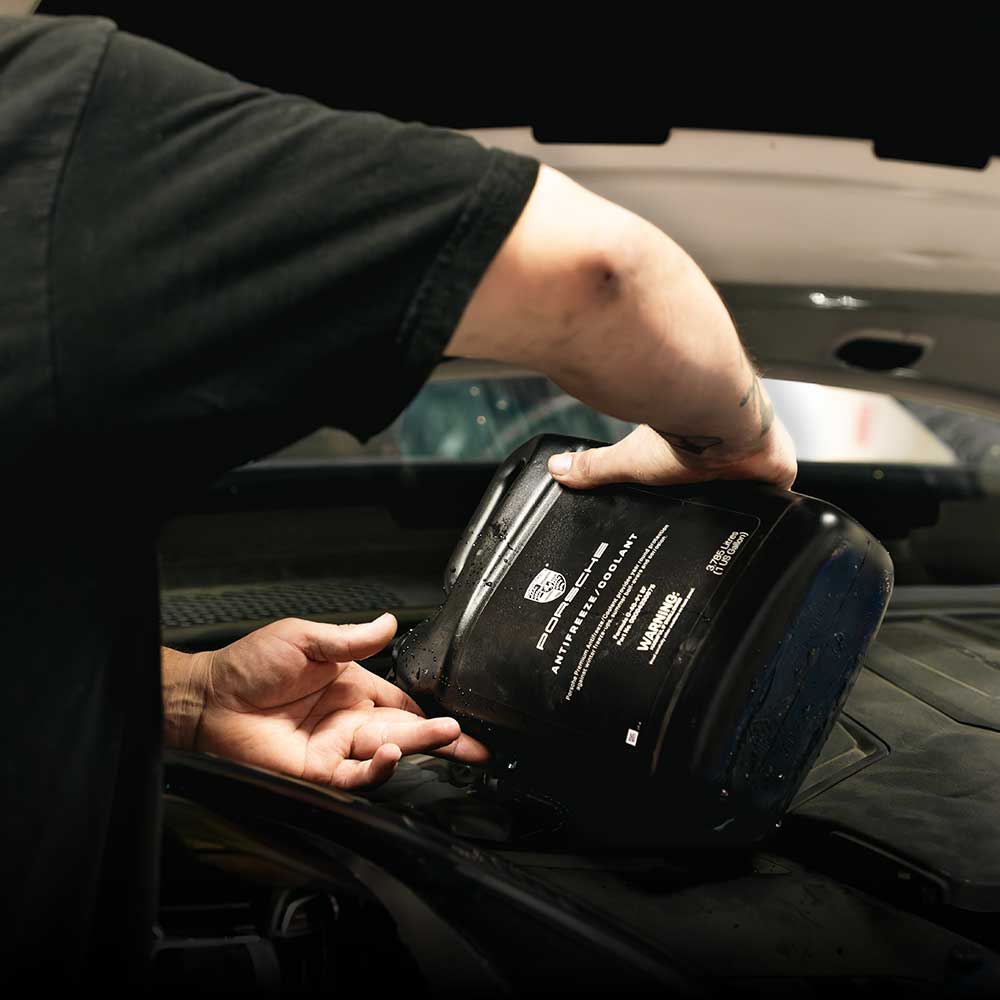 porsche tech topping off coolant on porsche