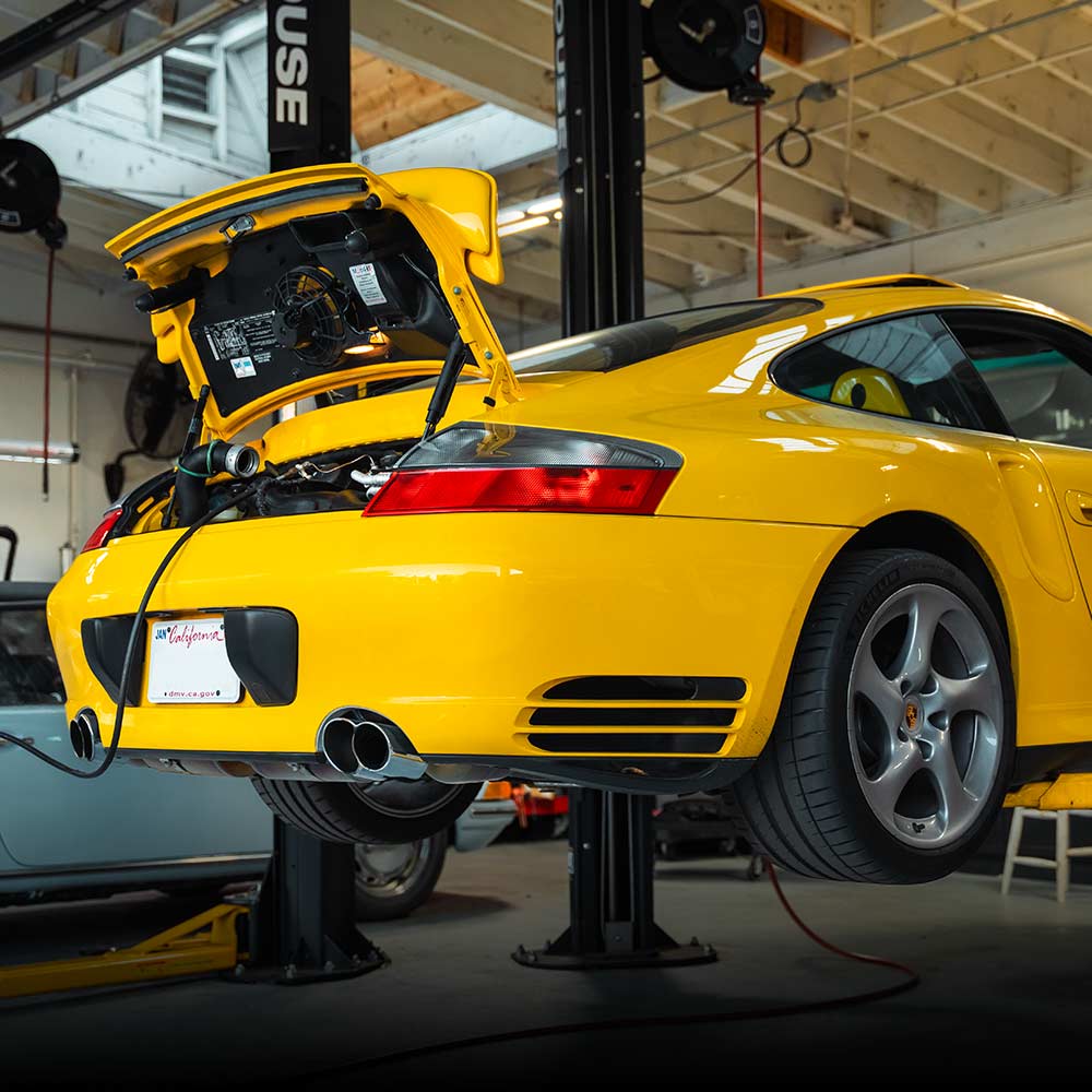 996 911 porsche in for service at house automotive on lift