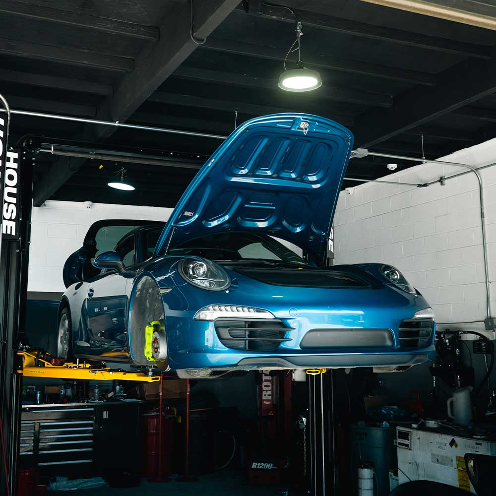ontario porsche owner at house on lift