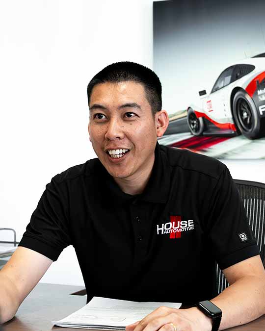 porsche service advisor providing customer consultation at house automotive los angeles office