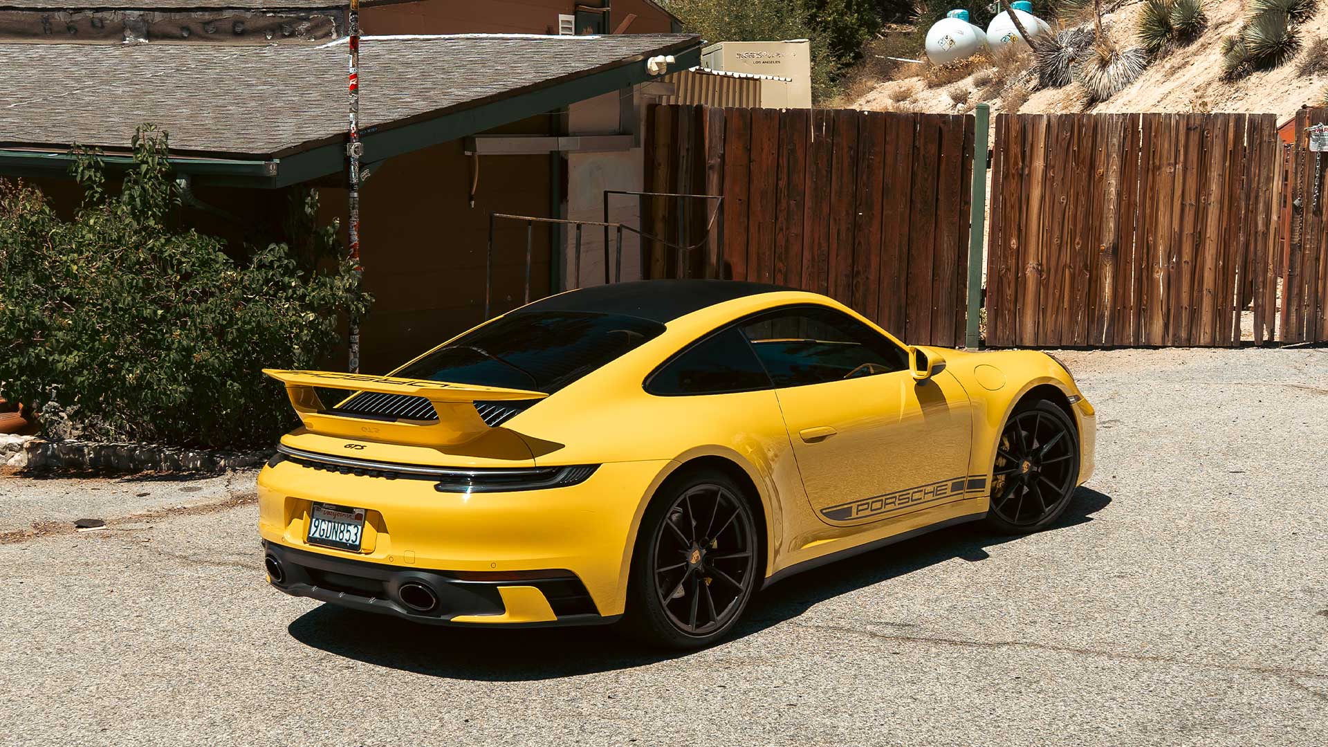 speed yellow 992 porsche 911 gts on angeles crest highway