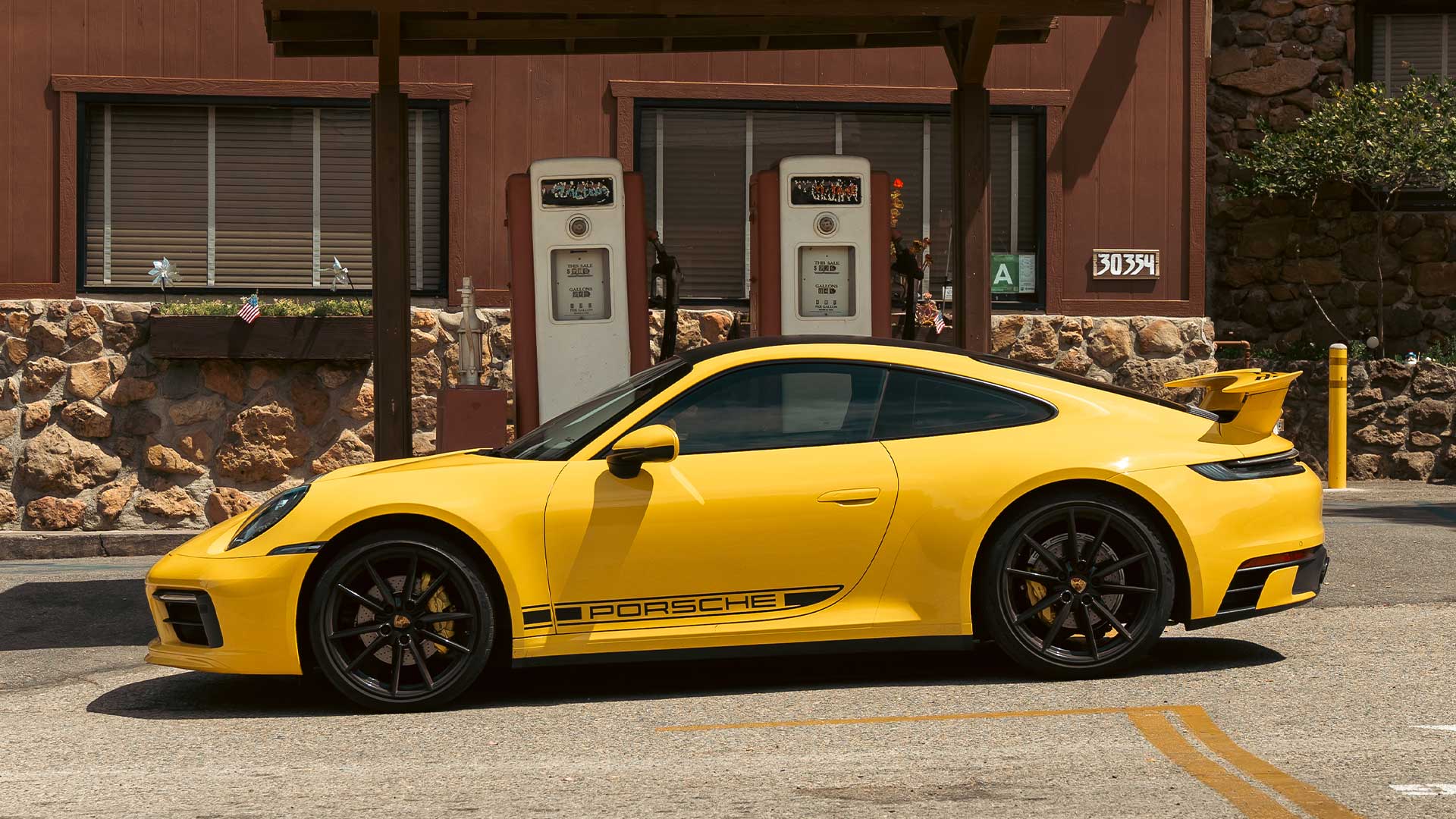 speed yellow 992 porsche 911 gts on mulholland drive
