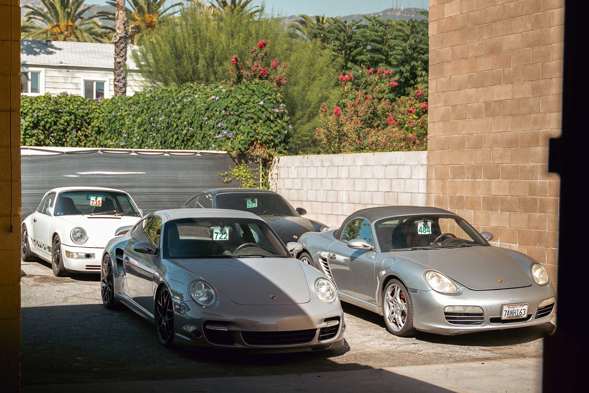 four porsches parked waiting for service